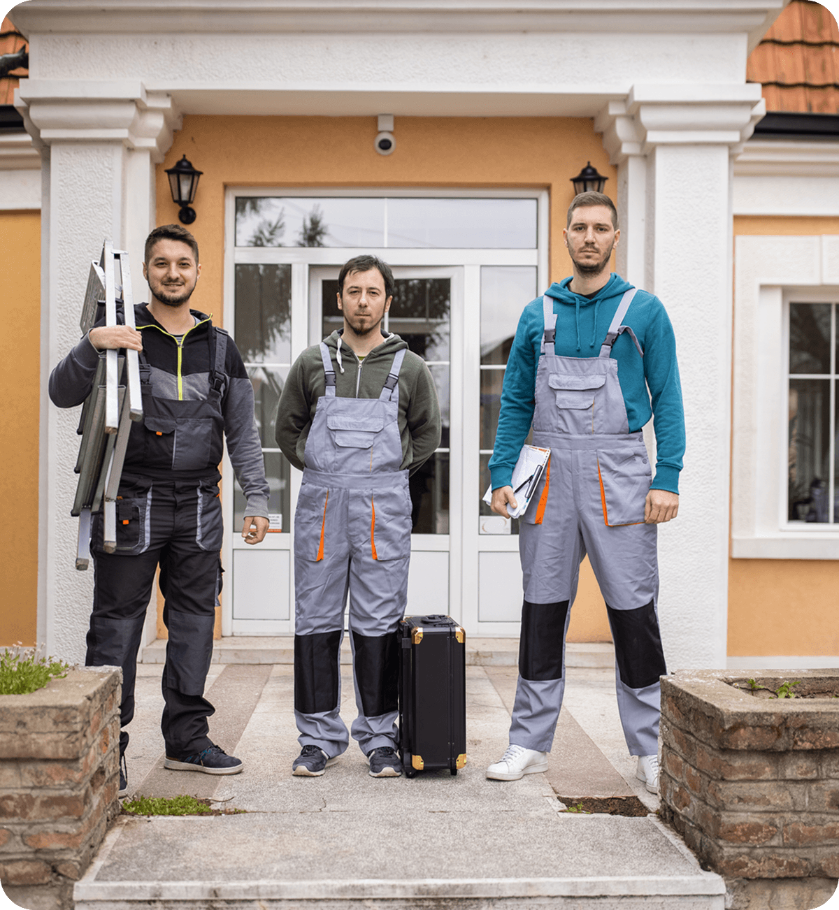 Three construction workers standing on pathway